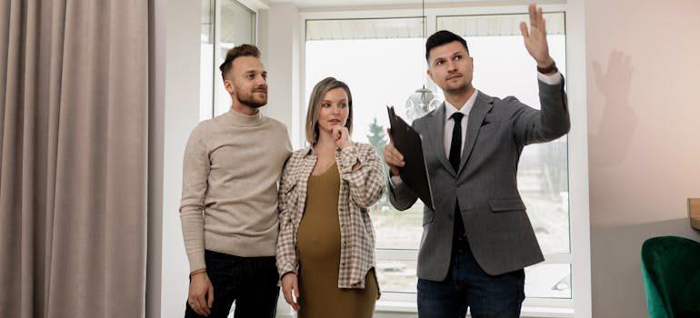 an agent showing a home to clients