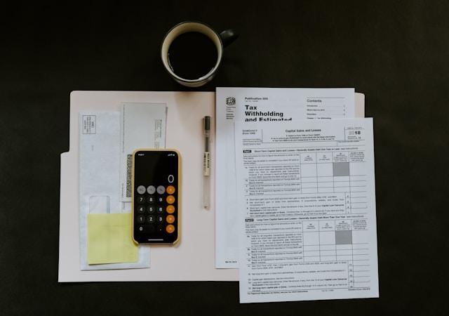 A cellphone on top of documents